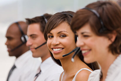 Happy call center employees with headset